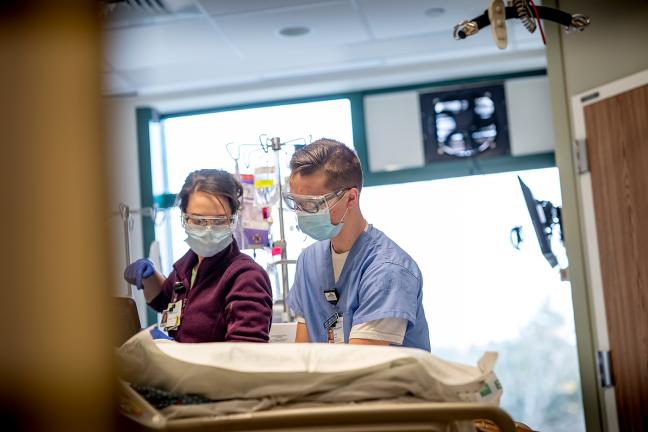 Student nurses working with patients