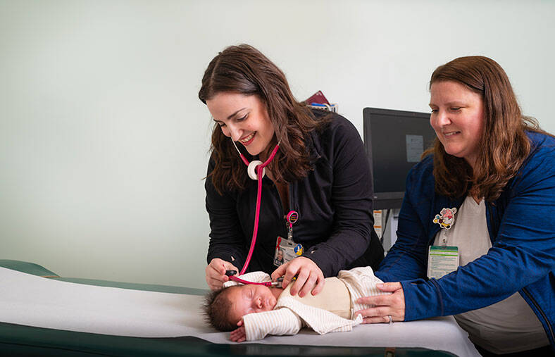 Nurses taking care of a baby at Dartmouth Hitchcock Clinics Manchester