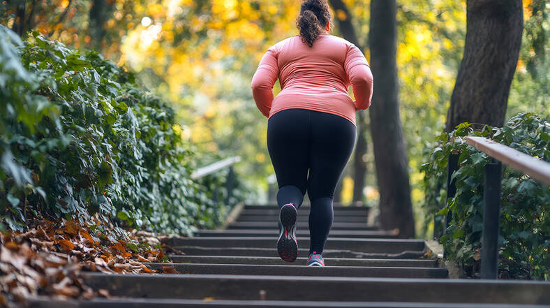 Weight Center: Healthy lifestyles, woman exercising walking up outdoor stairs, autumn