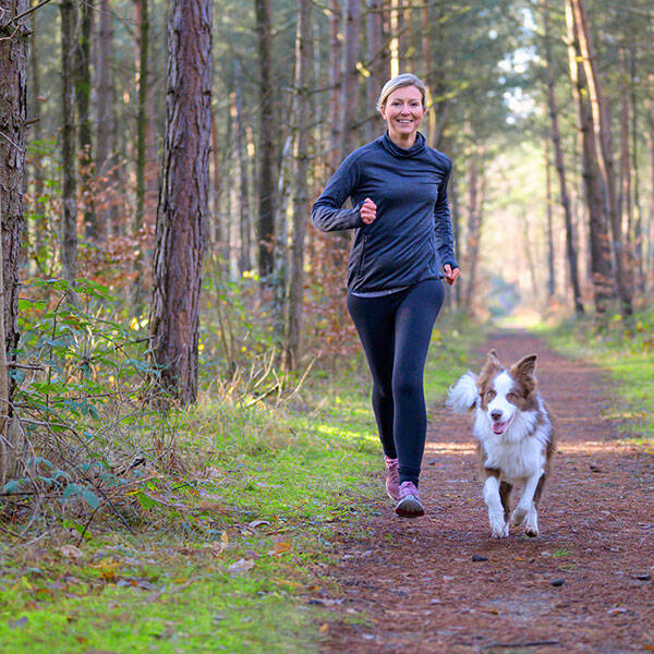 Woman running with her dog